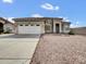 Charming single-story home with a desert-style front yard and a spacious two-car garage at 6752 W Citrus Way, Glendale, AZ 85303