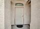 Inviting front entrance featuring a security door and textured walls for added curb appeal at 6752 W Citrus Way, Glendale, AZ 85303
