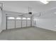 Spacious garage featuring ample storage space and a pristine, freshly painted interior at 6752 W Citrus Way, Glendale, AZ 85303