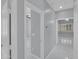 Hallway with gray walls and marble floors leading to the living room and another bedroom or room at 6752 W Citrus Way, Glendale, AZ 85303