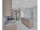 Modern kitchen features stainless appliances, gray cabinets, and a large island, perfect for meal prep and entertaining at 6752 W Citrus Way, Glendale, AZ 85303