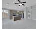 Bright kitchen features marble countertops, stainless steel appliances, and an island with bar seating at 6752 W Citrus Way, Glendale, AZ 85303