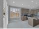 Well-lit kitchen features modern appliances, ample counter space, and a large window for natural light at 6752 W Citrus Way, Glendale, AZ 85303