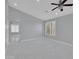 Spacious living room featuring modern tile floors, ceiling fan, neutral walls, and great natural light at 6752 W Citrus Way, Glendale, AZ 85303