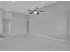 A spacious living room has a modern ceiling fan and neutral walls, creating a calming atmosphere at 6752 W Citrus Way, Glendale, AZ 85303