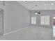 Spacious living room with recessed lighting, ceiling fan, neutral colors, and modern tile floors at 6752 W Citrus Way, Glendale, AZ 85303