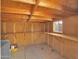 The shed features wooden shelves, a window, and storage containers at 6752 W Citrus Way, Glendale, AZ 85303