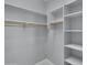 Walk-in closet with built-in shelving for optimal storage and organization at 6752 W Citrus Way, Glendale, AZ 85303