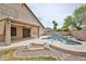 A large, private pool in the backyard with covered patio and mature desert landscaping at 6833 W Tether Trl, Peoria, AZ 85383