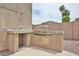 Backyard barbecue station with stainless steel gas grill and prep area at 6833 W Tether Trl, Peoria, AZ 85383
