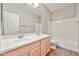 Bathroom with double sink vanity, tub, and tile flooring at 6833 W Tether Trl, Peoria, AZ 85383