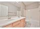 Bathroom featuring double sinks and a shower-tub combo with white accents at 6833 W Tether Trl, Peoria, AZ 85383