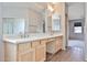 Bathroom features double sinks set in a vanity and tile floors at 6833 W Tether Trl, Peoria, AZ 85383