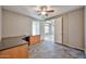 Large room with tile floor, ceiling fan, and a custom desk; great for study or office space at 6833 W Tether Trl, Peoria, AZ 85383