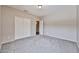 Cozy bedroom with carpet flooring, featuring a closet and a doorway at 6833 W Tether Trl, Peoria, AZ 85383