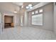 Inviting entryway with high ceilings, tile flooring, and large windows; creates a great first impression at 6833 W Tether Trl, Peoria, AZ 85383