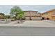 Two-story home featuring a three-car garage and desert landscaping at 6833 W Tether Trl, Peoria, AZ 85383