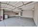 A roomy garage features a ceiling fan, storage cabinets, laundry hookups, and access to the house at 6833 W Tether Trl, Peoria, AZ 85383