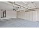 Spacious garage with storage cabinets, ceiling fan and an updated water heater at 6833 W Tether Trl, Peoria, AZ 85383