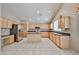 Large kitchen with stainless steel appliances, an island and ample cabinet space at 6833 W Tether Trl, Peoria, AZ 85383