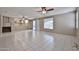 Spacious living room with tile flooring and a sliding door leading to the backyard at 6833 W Tether Trl, Peoria, AZ 85383