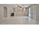 Open concept living room with tile flooring and plenty of natural light at 6833 W Tether Trl, Peoria, AZ 85383
