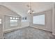 Spacious loft with tile flooring, natural light, and neutral colors; perfect as a play area at 6833 W Tether Trl, Peoria, AZ 85383