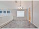 Bright loft area with tile flooring, plenty of natural light, and view of the staircase at 6833 W Tether Trl, Peoria, AZ 85383