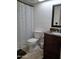 Cozy bathroom with a marble counter, toilet, and shower curtain, providing a comfortable and functional space at 740 N Oracle --, Mesa, AZ 85203