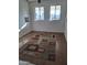 Bright bedroom with wood floors, and a geometric rug, filled with natural light from dual windows at 740 N Oracle --, Mesa, AZ 85203
