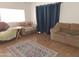Comfortable living room with sofas, and a patterned rug, creating a welcoming space for relaxation at 740 N Oracle --, Mesa, AZ 85203