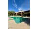 Community pool area featuring a pool, lounge chairs and manicured landscaping at 7432 E Hum Rd # 203, Carefree, AZ 85377
