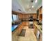 A gourmet kitchen featuring granite countertops, stainless steel appliances, and wood cabinets at 7432 E Hum Rd # 203, Carefree, AZ 85377