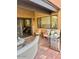 Outdoor patio with a grill, wicker seating and a tile floor at 7432 E Hum Rd # 203, Carefree, AZ 85377