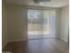 Cozy bedroom with laminate flooring, bright window, and access to a private balcony at 7575 E Indian Bend Rd # 1100, Scottsdale, AZ 85250