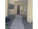 Inviting condo entrance with open door and neutral tones, creating a welcoming and bright arrival at 7575 E Indian Bend Rd # 1100, Scottsdale, AZ 85250