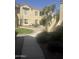 Inviting condo exterior with landscaped courtyard, providing a serene and welcoming atmosphere at 7575 E Indian Bend Rd # 1100, Scottsdale, AZ 85250