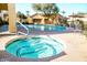 Relaxing hot tub with tiled interior, next to the community pool at 7575 E Indian Bend Rd # 1100, Scottsdale, AZ 85250