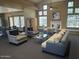 Spacious lounge area with comfortable seating, fireplace, and ample natural light at 7575 E Indian Bend Rd # 1100, Scottsdale, AZ 85250