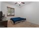 Simple bedroom showcasing a twin bed, window with blinds, and carpeted flooring at 7818 S 74Th Ave, Laveen, AZ 85339