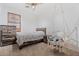 Stylish bedroom with a unique hanging chair, ceiling fan, a twin bed and a dresser at 7818 S 74Th Ave, Laveen, AZ 85339