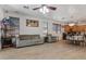 Spacious living room with tile floors, neutral furniture and an open layout at 7818 S 74Th Ave, Laveen, AZ 85339