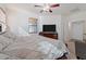 Spacious main bedroom with a ceiling fan, TV, dresser, and bright windows with blinds at 7818 S 74Th Ave, Laveen, AZ 85339