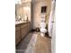 Neutral colored bathroom including framed art, bath mat, and toilet at 9450 E Becker Ln # 2051, Scottsdale, AZ 85260