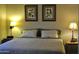 A warmly lit bedroom with neutral decor and comfortable furnishings at 9450 E Becker Ln # 2051, Scottsdale, AZ 85260