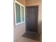 A solid front door with a large window on one side at 9450 E Becker Ln # 2051, Scottsdale, AZ 85260