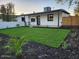 Landscaped backyard featuring new turf, fresh mulch, and a privacy fence at 954 E Henry St, Tempe, AZ 85288