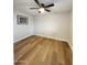 This bedroom features wood floors and a ceiling fan at 954 E Henry St, Tempe, AZ 85288