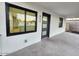 Modern home front with a black framed window, stylish door, and freshly painted exterior at 954 E Henry St, Tempe, AZ 85288