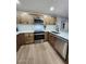 Kitchen with stainless steel appliances, modern fixtures, updated cabinetry, and sleek countertops at 954 E Henry St, Tempe, AZ 85288